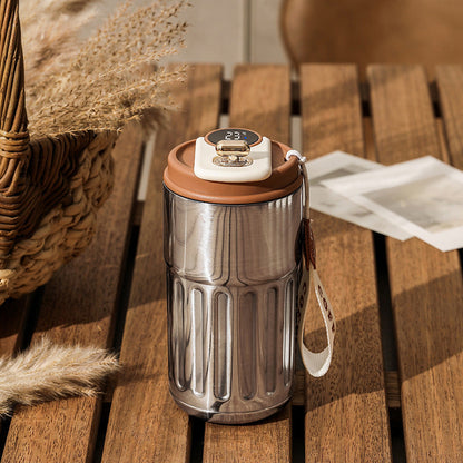 Smart digital thermos with LED temperature display in stainless steel finish color silver with coffee brown 