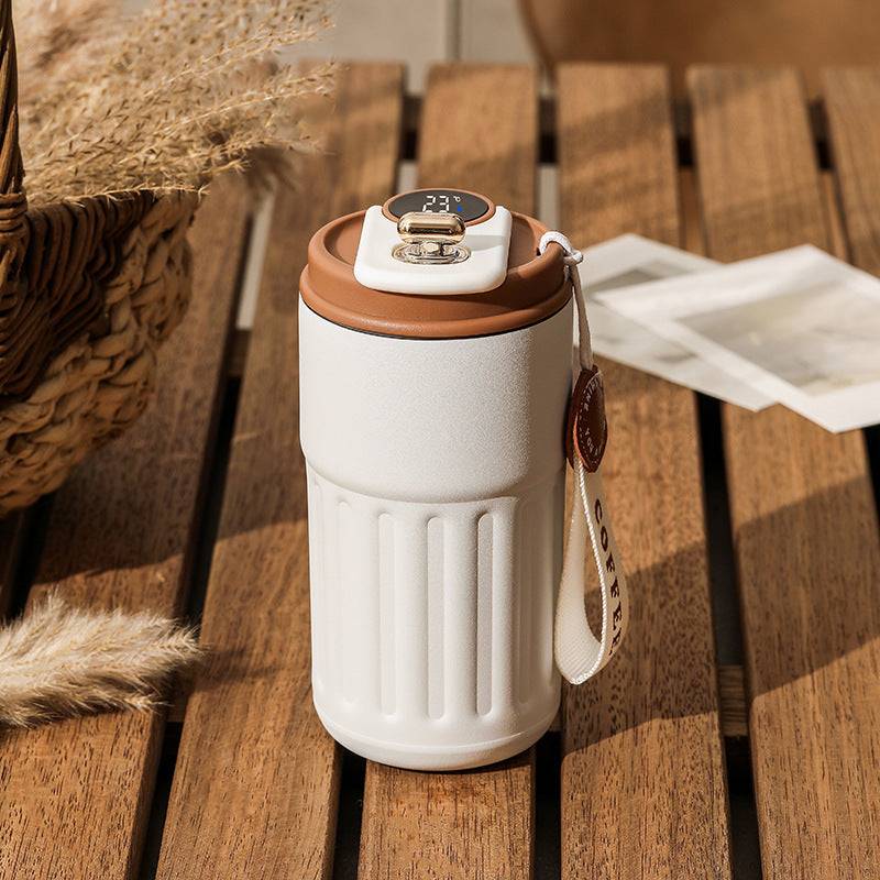 Smart digital thermos with LED temperature display in stainless steel finish color white with coffee brown lid.